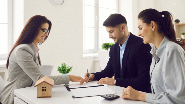 A couple signing documents as co-applicant for home loan in India.